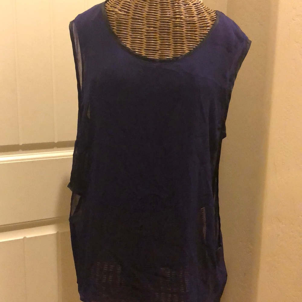 Women’s KIIND OF purple sleeveless top.